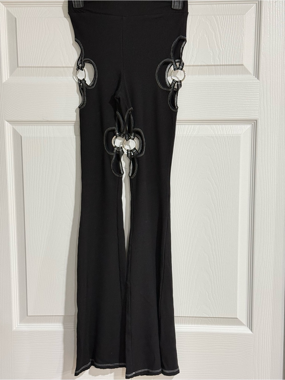 AKIRA Black Flared Leggings with Silver Ring Cutouts
